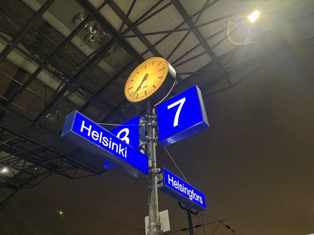 Do they speak English In Finland? Everything You Need To Know - Around Europe Sign at train station in Helsinki, showing Finnish and Swedish
