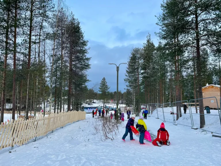children playing in the snow in lapland