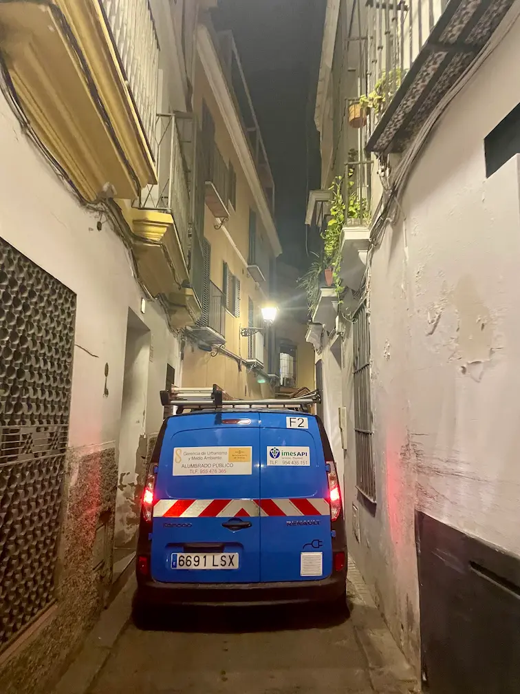 Renting a Car in Seville: Tips, Costs & All You Need to Know - Around Europe Narrow street in Seville, Andalusia