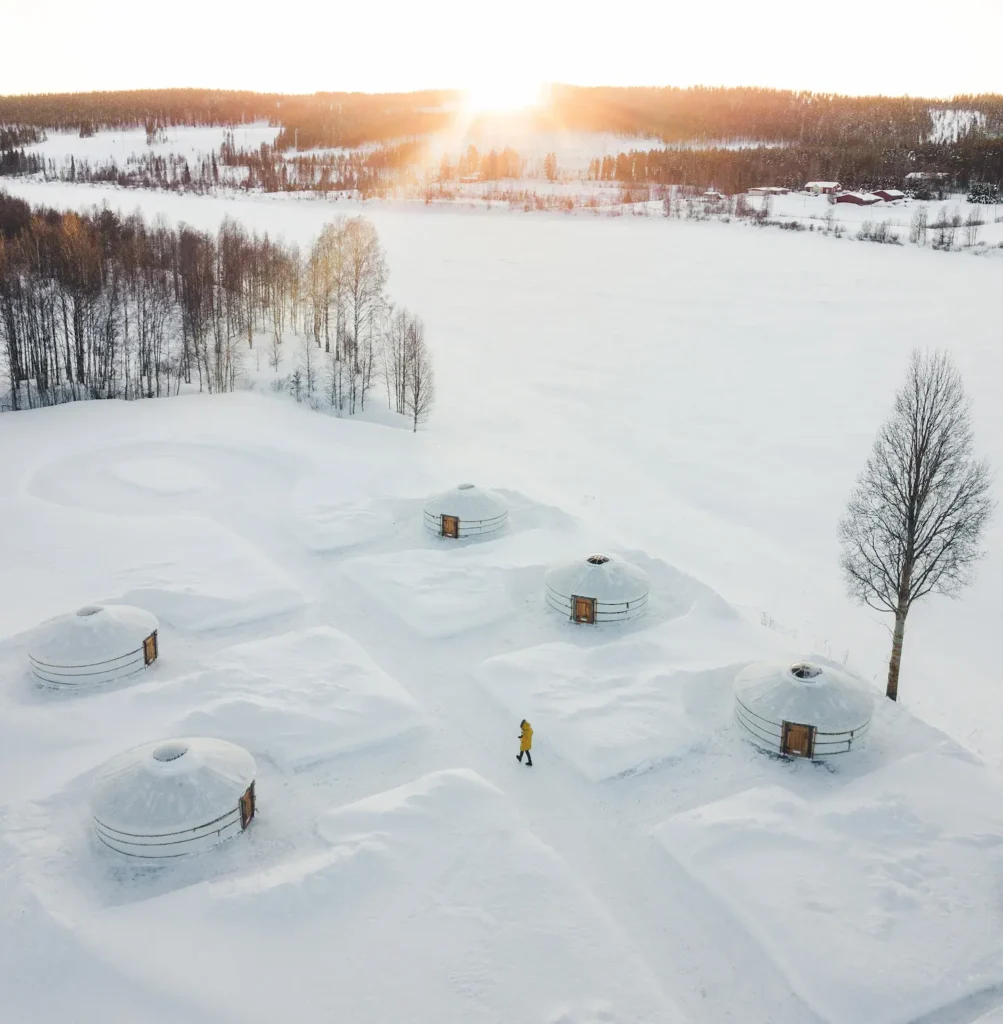 8 Truly Unique Stays In Lapland That You’ll Love - Around Europe Yurt District near Rovaniemi from the air